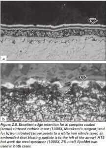 Figure 2.8 Excelent edge retention for a: complex coated (arrow) sintered carbide insert (1000X Murakamis reagent) and for b: iron nitride (arrow points to a white iron nitride layer; an embedded shot blasting particle is to the left of the arrow) H13 hot work die steel specimen (1000X 2% nital). Epomet was used in both cases.