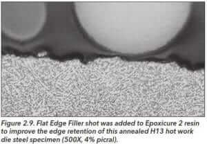 Figure 2.9 Flat edge Filler shot was added to EpoxiCure 2 resin to improve the edge retention of this annealed H13 hot work die steel specimen (500X 4% picral).